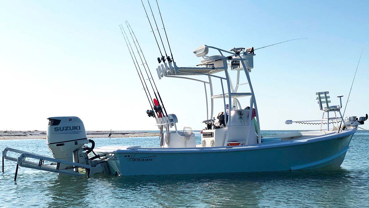 InshoreAction Charter's Hanson staked out in the flats with dual power-poles.