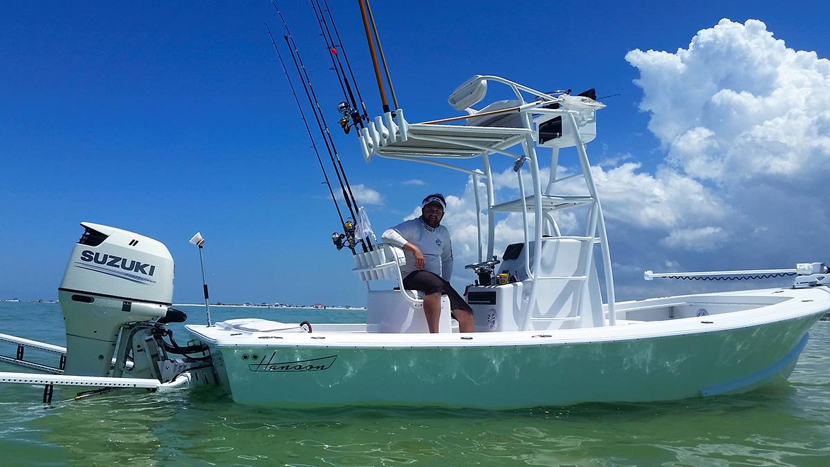 Captain Matt Luttmann with his Hanson charter boat anchored in the shallows with Powerpoles.
