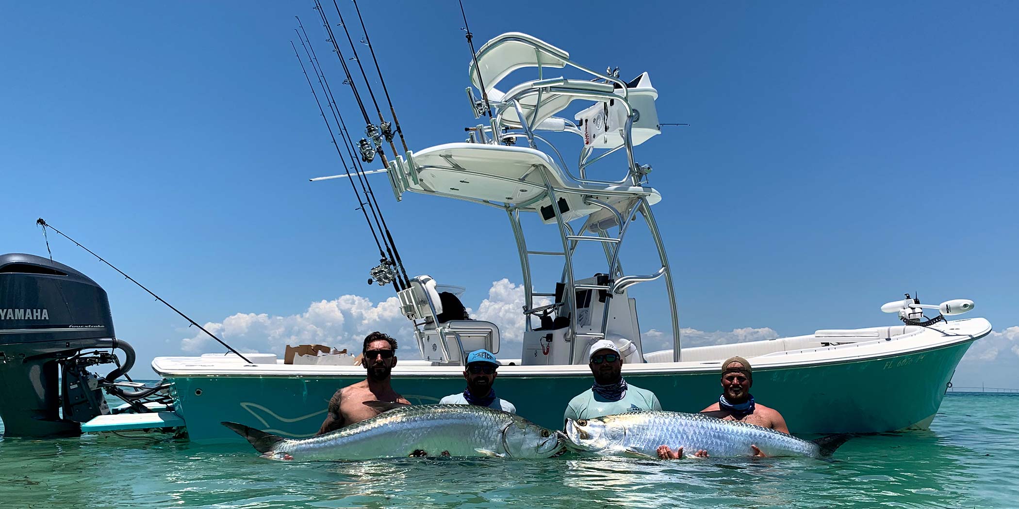 Landed a pair of big tarpons during a summer charter, and had to pose with them next to the boat.