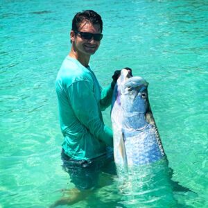 Had to jump in the water with this tarpon after an exciting fight.